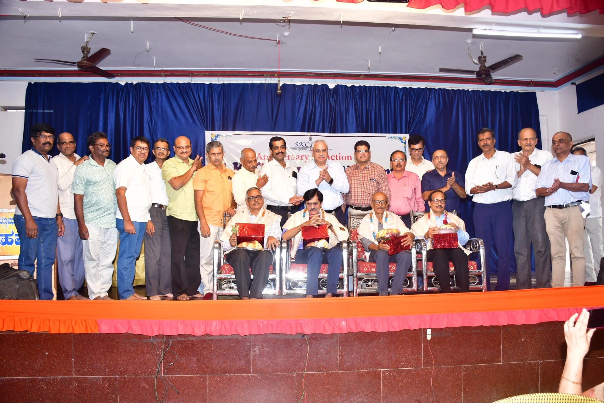 Esteemed Professors, Mahesh Adkoli, S. V. Kamat, T. G. Bhat and S. L. Shastry being felicitated in the 5th anniversary function of the Trust
