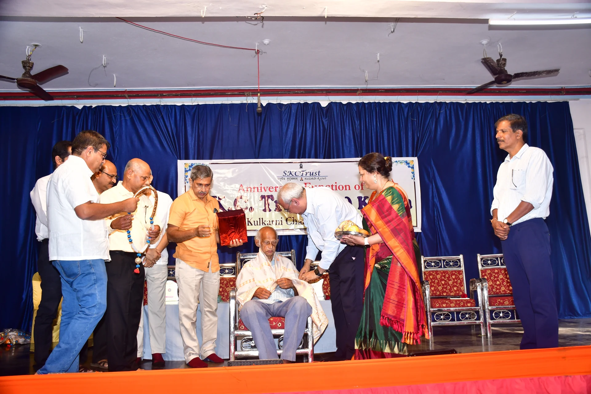 Esteemed Gibb High School Teacher V. T. Upadhyaya being felicitated in the 5th anniversary function of the Trust